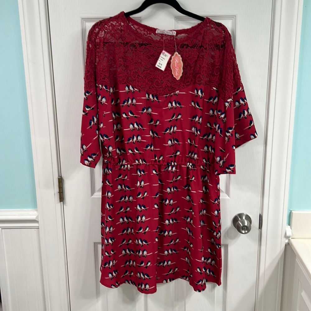 NWT red dress with lace upper.  Bottom of dress has bird print.  Size large.